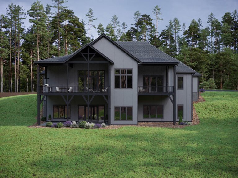 A modern, two-story cabin nestled in a lush forest setting. The exterior features a gray color scheme with a gabled roof, large windows, and a wraparound porch. The cabin is surrounded by a well-manicured lawn and surrounded by tall pine trees, creating a serene and peaceful atmosphere.