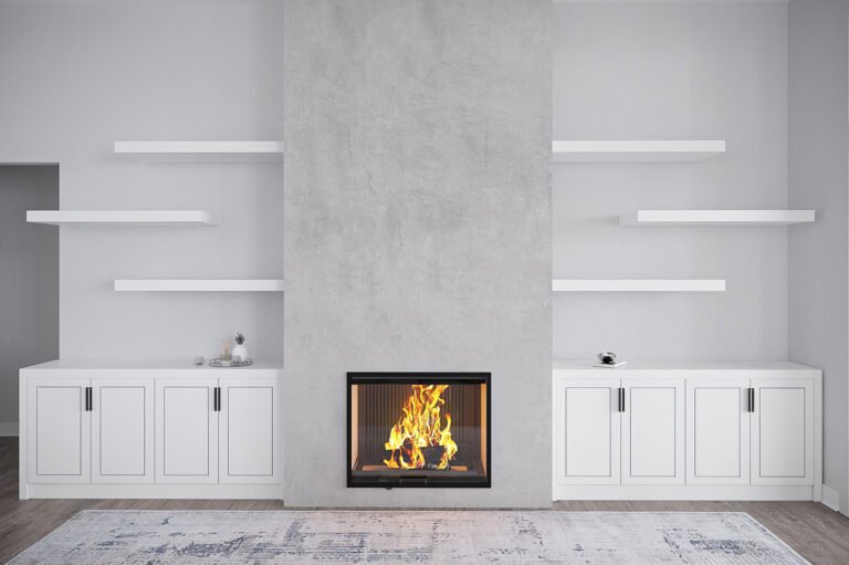 A modern, minimalist living room with a large, central fireplace surrounded by built-in white cabinets and shelves. The room features a neutral color palette, with a textured gray wall as the focal point. The fireplace is the central element, with a roaring fire visible through the glass panel. The overall design creates a cozy and inviting atmosphere.